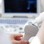 ultrasound-scanner-equipmentin-clinic-hospital-diagnostics-sonography-health-concept-700x467